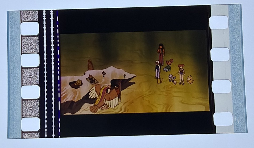 A 35mm film cell from Pokémon: The First Movie on the Crown light panel at intake