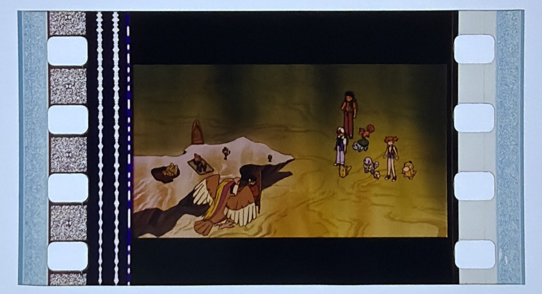 A 35mm film cell from Pokémon: The First Movie on the Crown light panel at intake